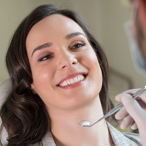 Young woman getting oral surgery for a healthier smile.